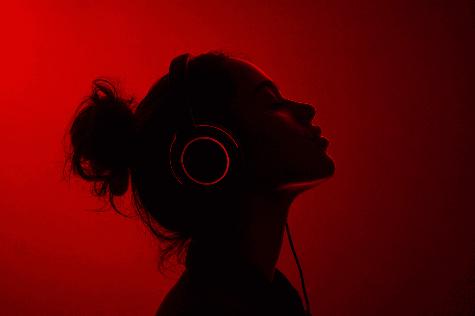 Creator listening to audio with headphones
